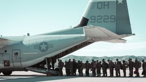 career extending soldiers boarding a plane